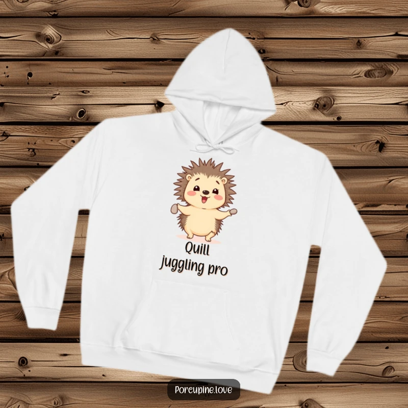 Funny cheerful porcupine hoodie, juggling three small pebbles with its quills, a cozy and impressive display of skill.